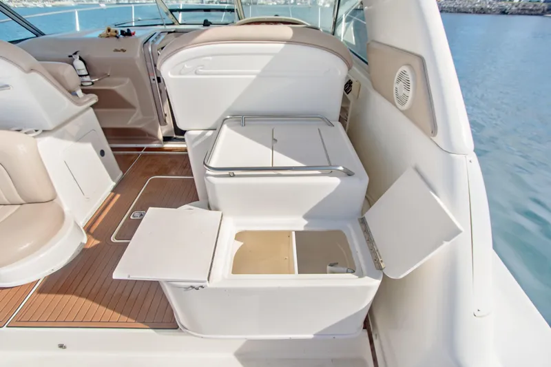 Sandie Lee Yacht Photos Pics 2000 Sea Ray 370 Express Cruiser interior with open storage compartments and seating.