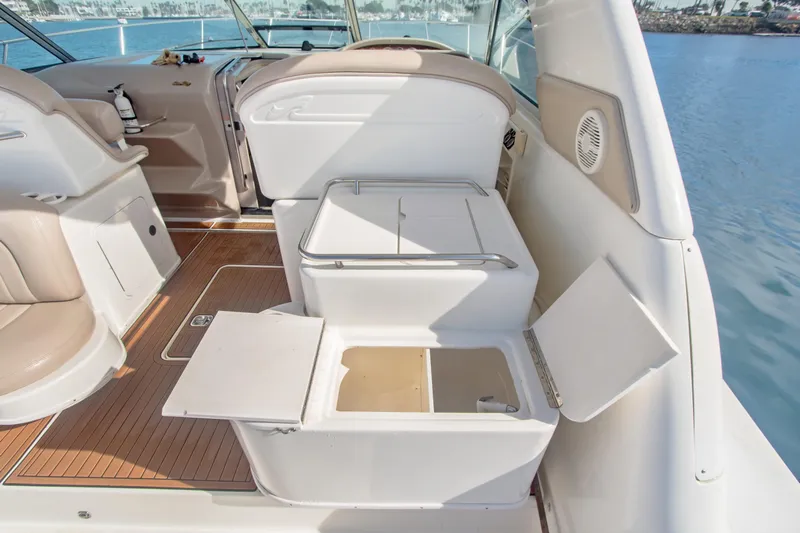 Sandie Lee Yacht Photos Pics 2000 Sea Ray 370 Express Cruiser interior with open storage compartments on deck.