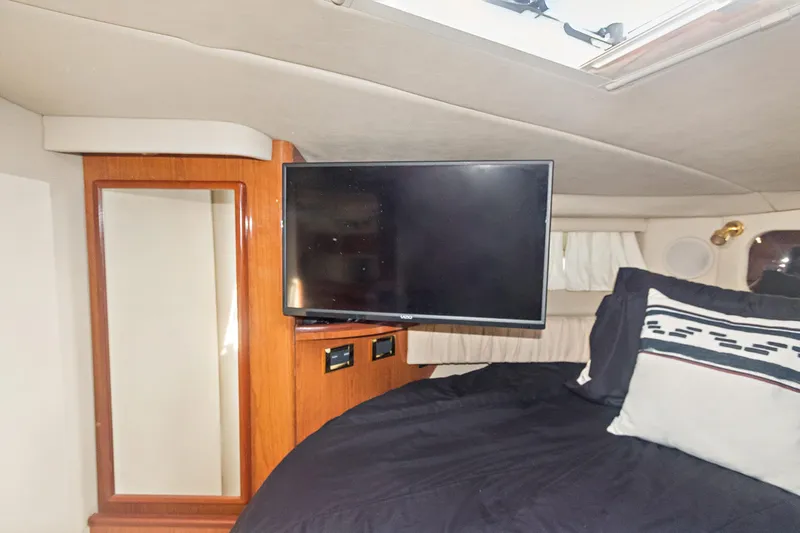 Sandie Lee Yacht Photos Pics Interior of 2000 Sea Ray 370 Express Cruiser with TV and bed.