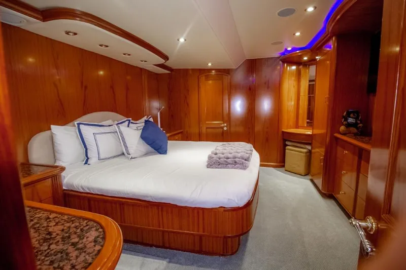 Reel Deal Yacht Photos Pics Luxurious cabin interior of 2005 Sea Force Sportfish yacht with elegant wood finish.