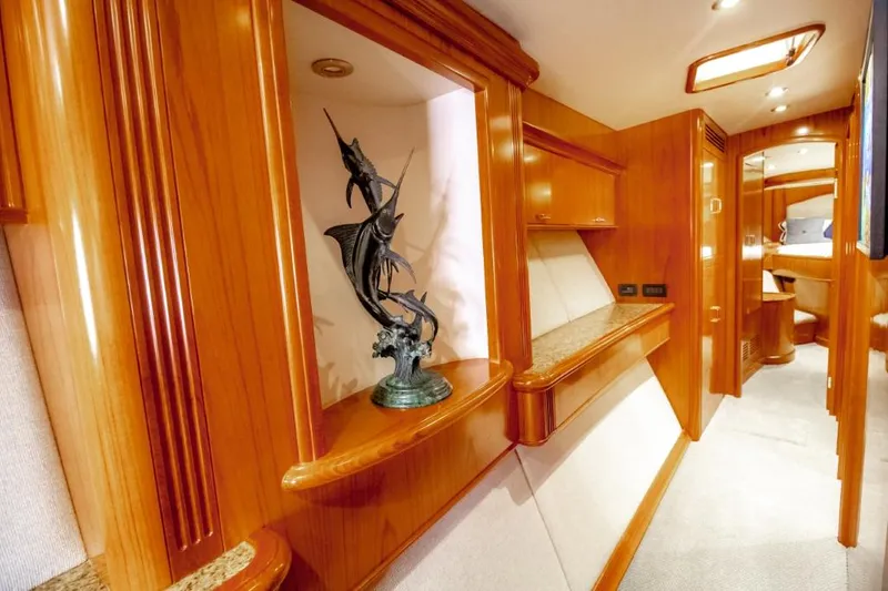 Reel Deal Yacht Photos Pics Luxurious 2005 Sea Force Sportfish yacht interior with elegant wood finishes and marlin sculpture.