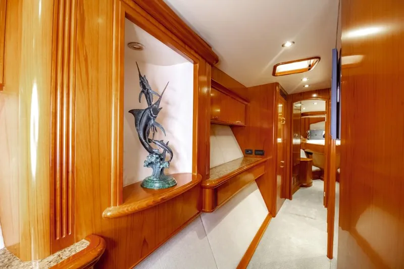 Reel Deal Yacht Photos Pics Luxurious 2005 Sea Force Sportfish yacht interior with elegant wood finish and marlin sculpture.