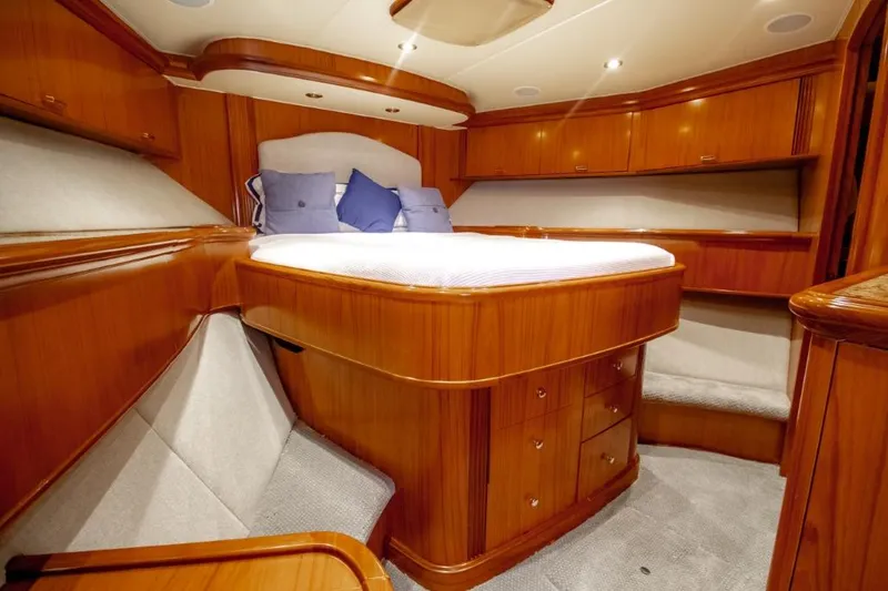 Reel Deal Yacht Photos Pics Luxurious cabin interior of 2005 Sea Force Sportfish yacht with wooden furnishings.