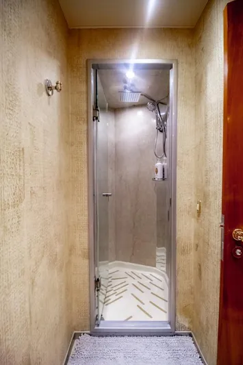 Reel Deal Yacht Photos Pics Luxurious shower in 2005 Sea Force Sportfish yacht, featuring modern fixtures and elegant design.