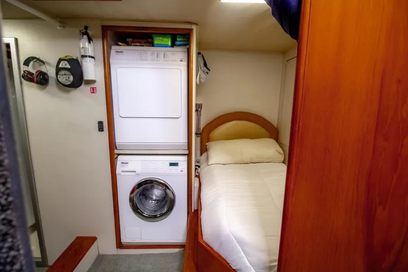 Reel Deal Yacht Photos Pics 2005 Sea Force Sportfish cabin with bed and stacked washer-dryer unit.