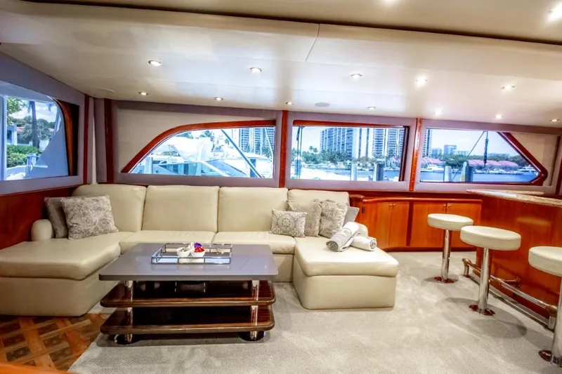 Reel Deal Yacht Photos Pics Luxurious interior of a 2005 Sea Force Sportfish yacht with plush seating and elegant decor.