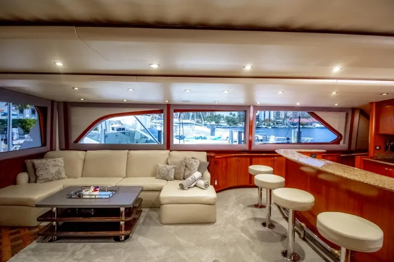 Reel Deal Yacht Photos Pics Luxurious 2005 Sea Force Sportfish yacht interior with plush seating and bar stools.