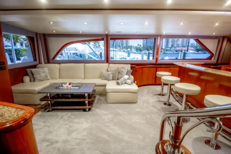Reel Deal Yacht Photos Pics Luxurious 2005 Sea Force Sportfish yacht interior with plush seating and elegant wood finishes.