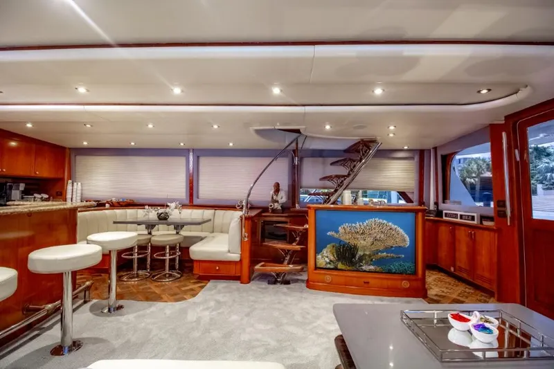 Reel Deal Yacht Photos Pics Luxurious 2005 Sea Force Sportfish yacht interior with elegant seating and spiral staircase.