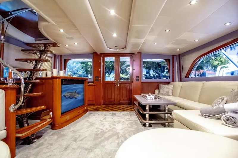 Reel Deal Yacht Photos Pics Luxurious interior of a 2005 Sea Force Sportfish yacht with elegant wood finishes and plush seating.