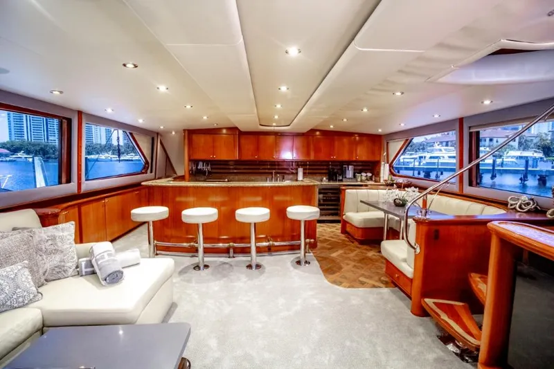 Reel Deal Yacht Photos Pics Luxurious 2005 Sea Force Sportfish yacht interior with elegant seating and modern kitchen.