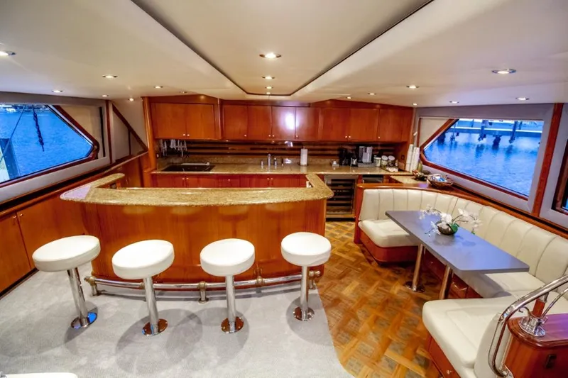 Reel Deal Yacht Photos Pics Luxurious 2005 Sea Force Sportfish yacht interior with elegant wood finishes and modern seating.