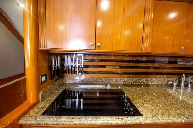 Reel Deal Yacht Photos Pics Luxurious 2005 Sea Force Sportfish yacht kitchen with granite countertops and modern appliances.