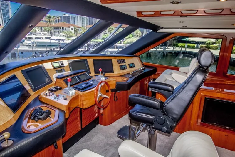 Reel Deal Yacht Photos Pics Luxurious 2005 Sea Force Sportfish yacht cockpit with advanced navigation equipment and plush seating.