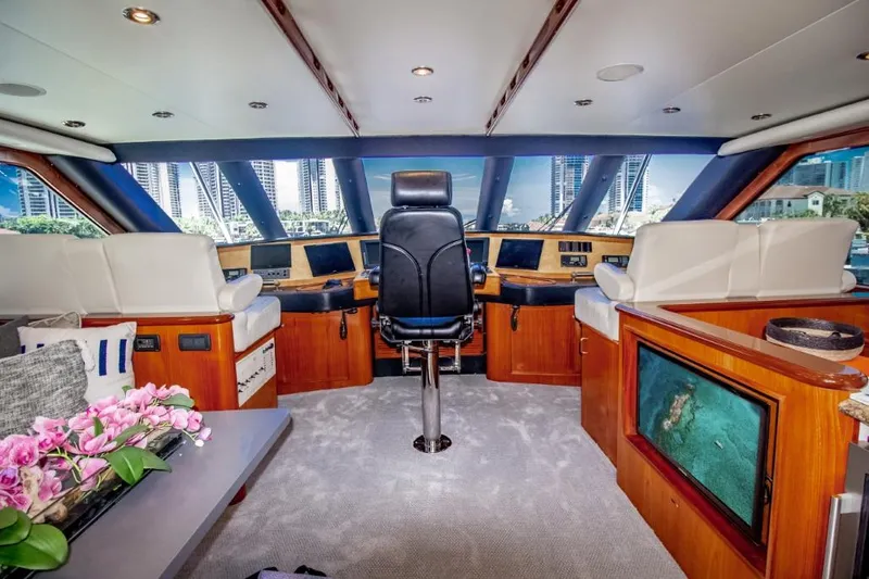 Reel Deal Yacht Photos Pics Luxurious 2005 Sea Force IX Sportfish yacht interior with modern helm and panoramic windows.
