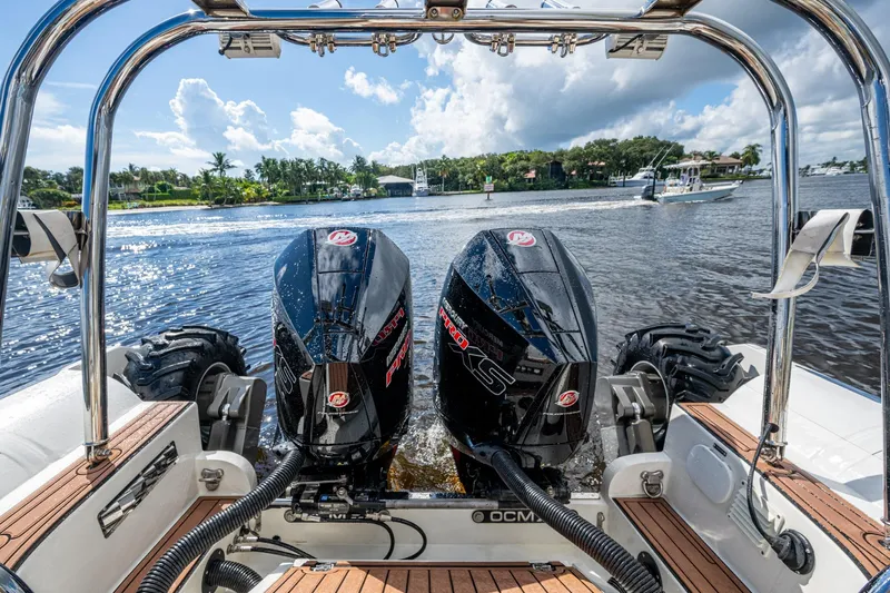 No Name Yacht Photos Pics 2023 Ocean Craft 38 boat with dual outboard motors on a sunny day.