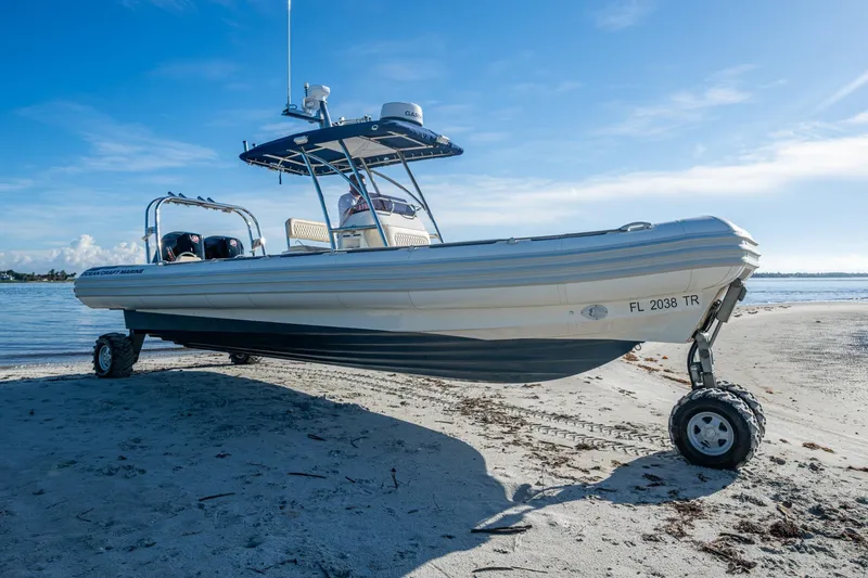 No Name Yacht Photos Pics 2023 Ocean Craft 38 amphibious boat on sandy beach with wheels extended.