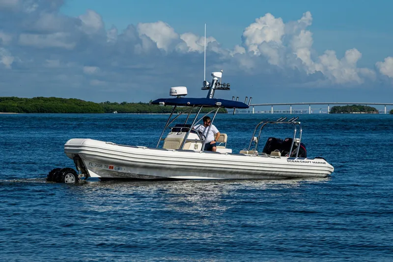 No Name Yacht Photos Pics 2023 Ocean Craft 38 boat cruising on blue water under a clear sky.