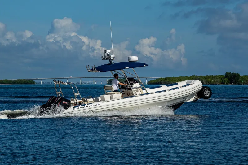 No Name Yacht Photos Pics 2023 Ocean Craft 38 boat cruising on water with clear blue sky background.