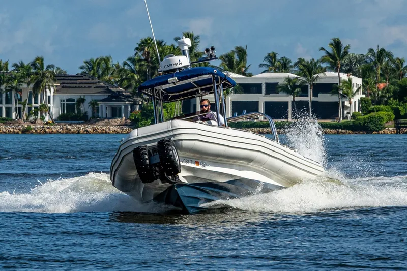 No Name Yacht Photos Pics 2023 Ocean Craft 38 boat cruising on water near luxury waterfront homes.