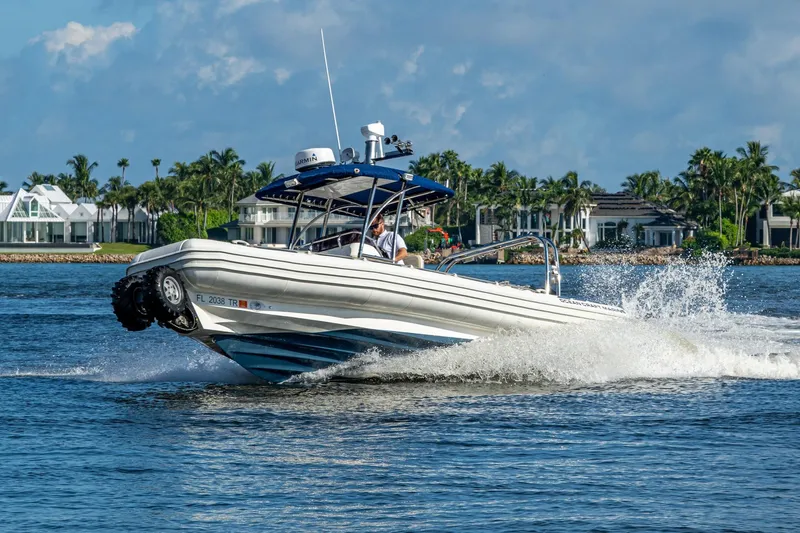 No Name Yacht Photos Pics 2023 Ocean Craft 38 boat cruising on water near luxury waterfront homes.