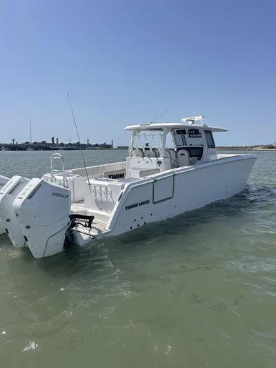  Yacht Photos Pics 2024 Twin Vee 400 GFX boat on water, featuring dual outboard engines.