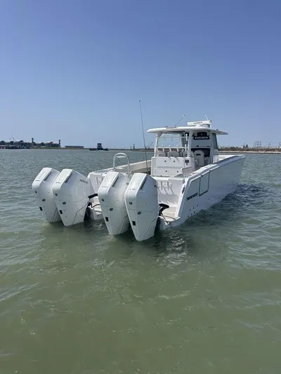  Yacht Photos Pics 2024 Twin Vee 400 GFX boat with triple engines on calm water.