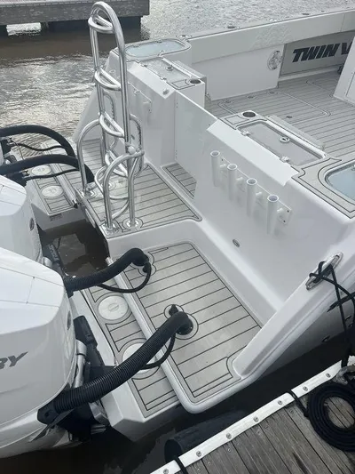  Yacht Photos Pics 2024 Twin Vee 400 GFX boat with dual engines and sleek deck design.