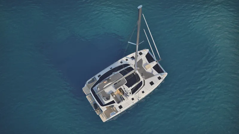 Fp 44 In St. Thomas, Usvi. Ex-factory April 2026 Yacht Photos Pics Aerial view of 2026 Fountaine Pajot 44 catamaran sailing on clear blue water.