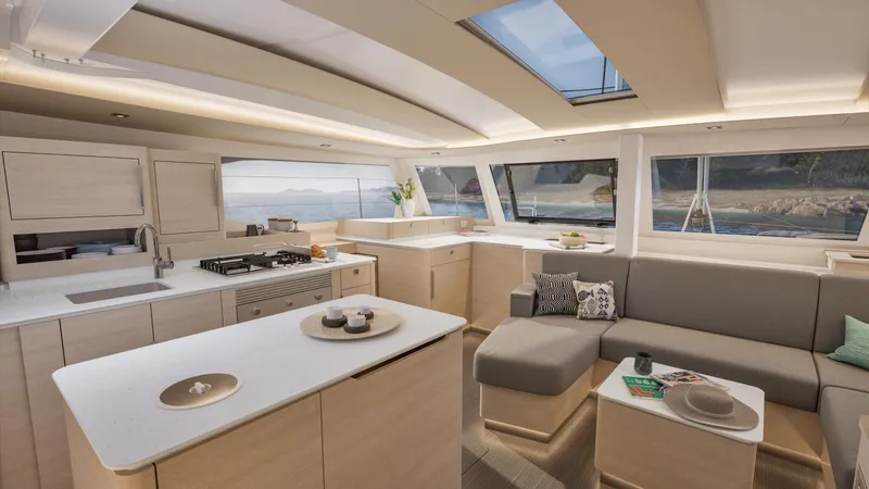 Fp 44 In St. Thomas, Usvi. Ex-factory April 2026 Yacht Photos Pics Luxurious interior of 2026 Fountaine Pajot 44 catamaran with modern kitchen and seating area.