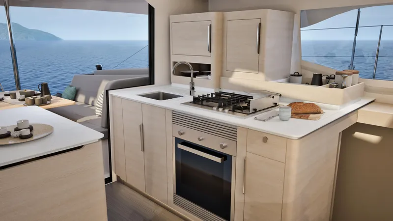 Fp 44 In St. Thomas, Usvi. Ex-factory April 2026 Yacht Photos Pics Modern kitchen interior on 2026 Fountaine Pajot 44 yacht, featuring sleek cabinetry and ocean view.
