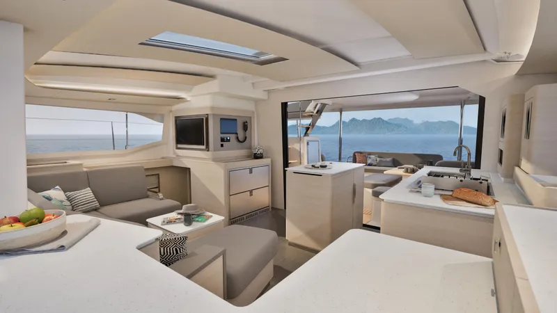 Fp 44 In St. Thomas, Usvi. Ex-factory April 2026 Yacht Photos Pics Luxurious interior of 2026 Fountaine Pajot 44 catamaran with modern kitchen and ocean view.