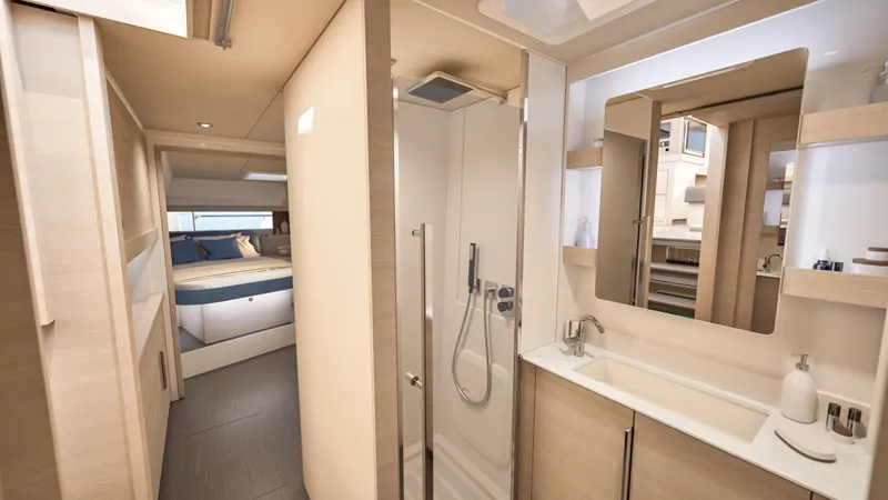 Fp 44 In St. Thomas, Usvi. Ex-factory April 2026 Yacht Photos Pics Luxurious interior of 2026 Fountaine Pajot 44 yacht, featuring modern bathroom and cozy bedroom.