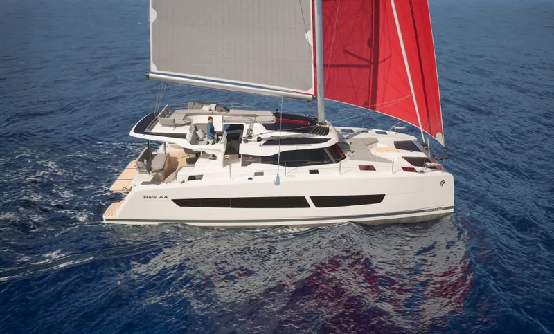 Fp 44 In St. Thomas, Usvi. Ex-factory April 2026 Yacht Photos Pics 2026 Fountaine Pajot 44 catamaran sailing with red sails on open sea.
