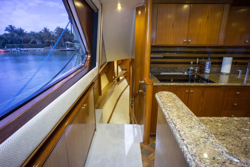Reel Deal Yacht Photos Pics Interior of 2005 Sea Force Sportfish yacht with wooden cabinets and granite countertops.