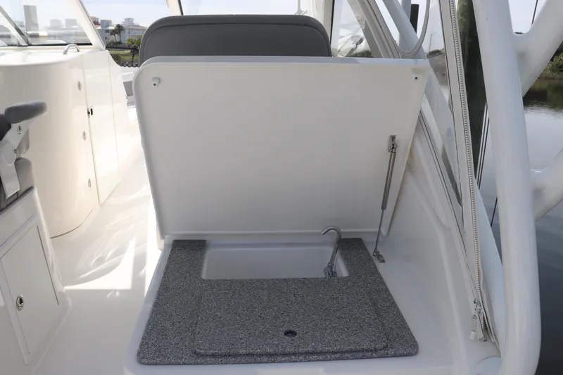 Reel Grateful Yacht Photos Pics 2021 Albemarle 31 DC boat interior with open storage compartment and sink.