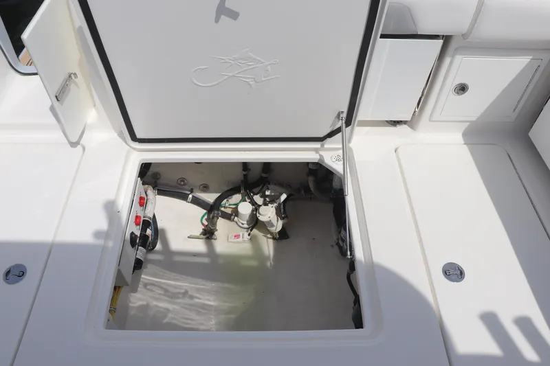 Reel Grateful Yacht Photos Pics Open hatch of 2021 Albemarle 31 DC boat showing internal components and storage area.