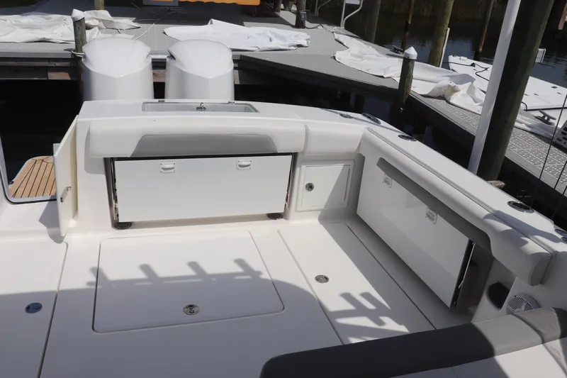 Reel Grateful Yacht Photos Pics 2021 Albemarle 31 DC boat interior with storage compartments and seating area.