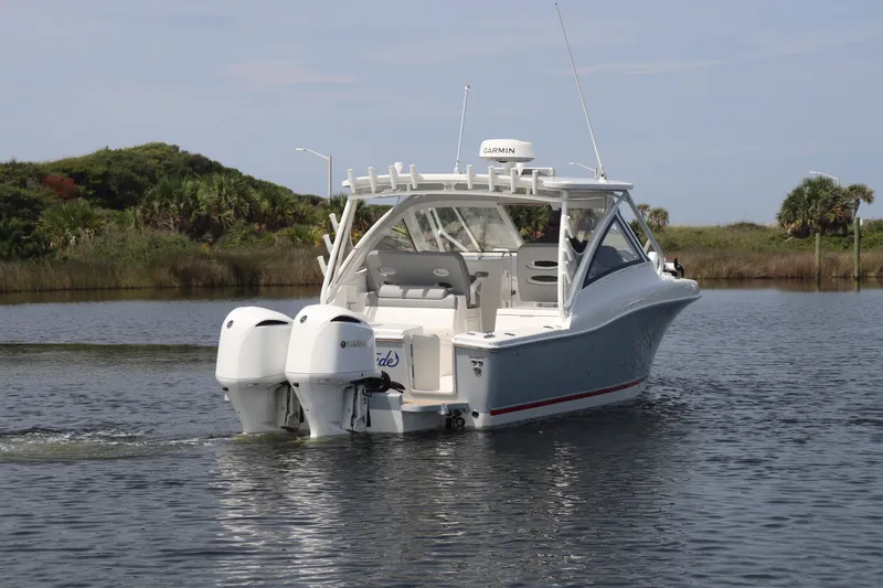 Reel Grateful Yacht Photos Pics 2021 Albemarle 31 DC boat with twin Yamaha engines on a calm waterway.