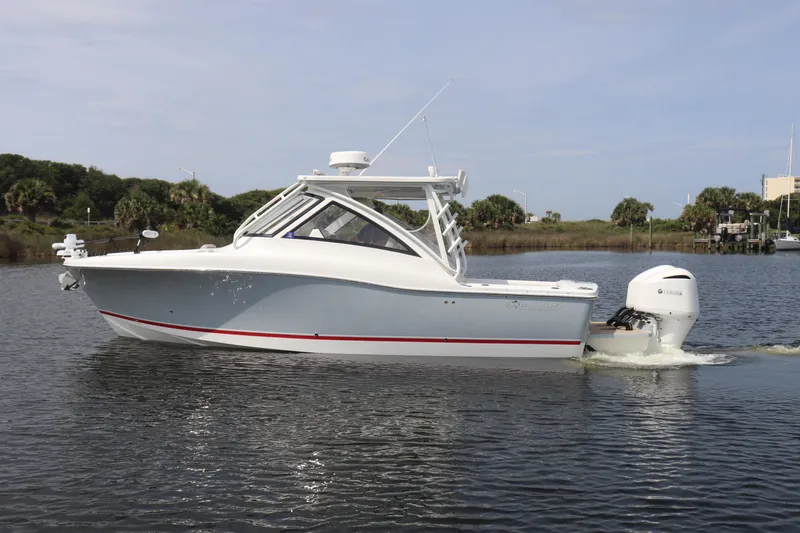 Reel Grateful Yacht Photos Pics 2021 Albemarle 31 DC boat cruising on calm water, side view.