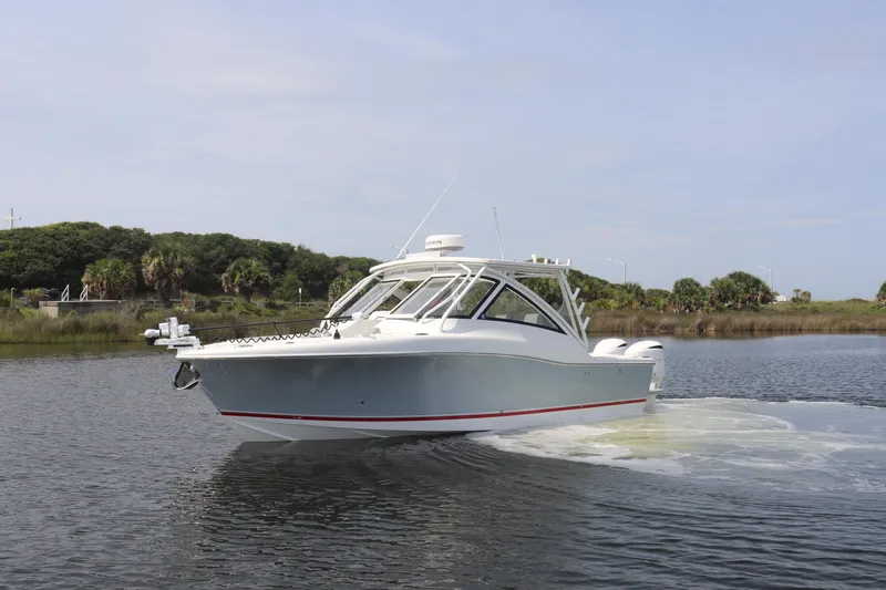 Reel Grateful Yacht Photos Pics 2021 Albemarle 31 DC boat cruising on a calm waterway.