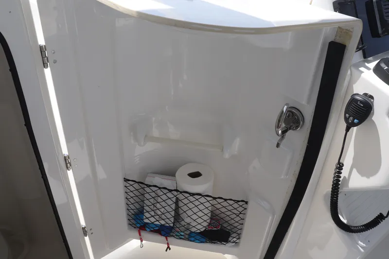 Reel Grateful Yacht Photos Pics Storage compartment on a 2021 Albemarle 31 DC boat with netting and essentials.