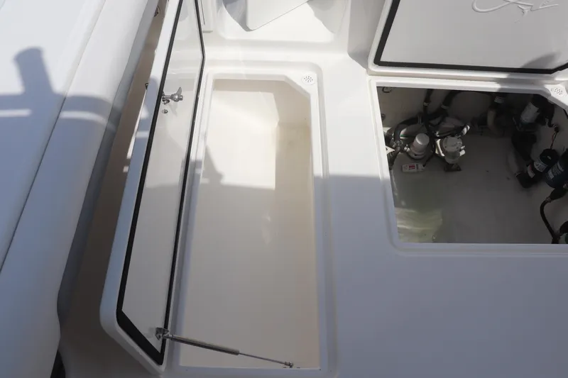 Reel Grateful Yacht Photos Pics Open storage compartments on a 2021 Albemarle 31 DC boat deck.