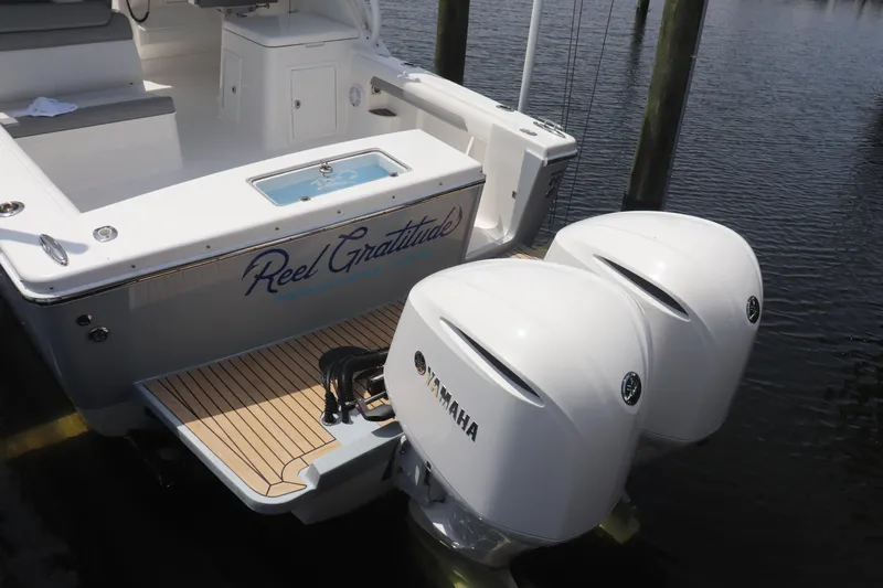 Reel Grateful Yacht Photos Pics 2021 Albemarle 31 DC boat with twin Yamaha engines docked at marina.