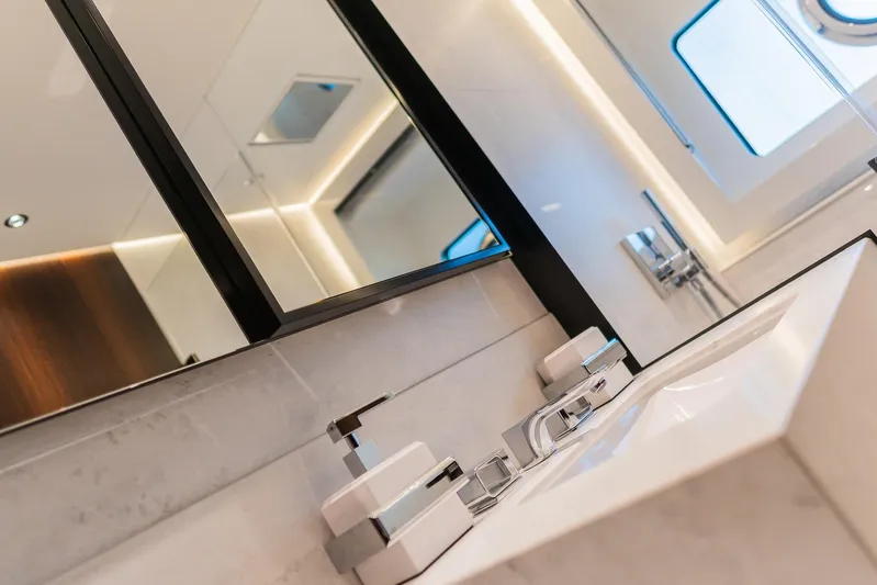  Yacht Photos Pics Luxurious bathroom interior on 2025 Sunseeker 90 Ocean yacht, featuring modern fixtures and elegant design.