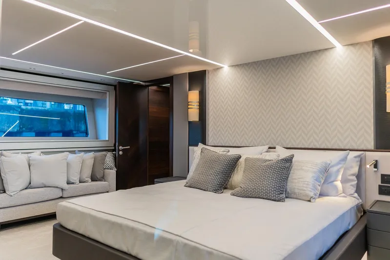  Yacht Photos Pics Luxurious bedroom interior of 2025 Sunseeker 90 Ocean yacht with modern design and elegant decor.