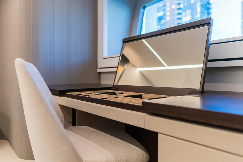  Yacht Photos Pics Luxurious interior of 2025 Sunseeker 90 Ocean yacht with elegant desk and chair.