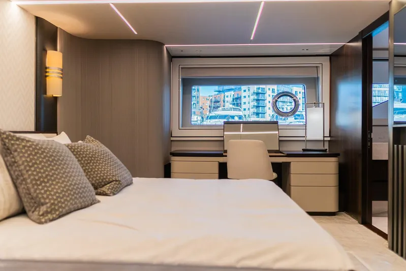  Yacht Photos Pics Luxurious bedroom interior of 2025 Sunseeker 90 Ocean yacht with modern design and city view.