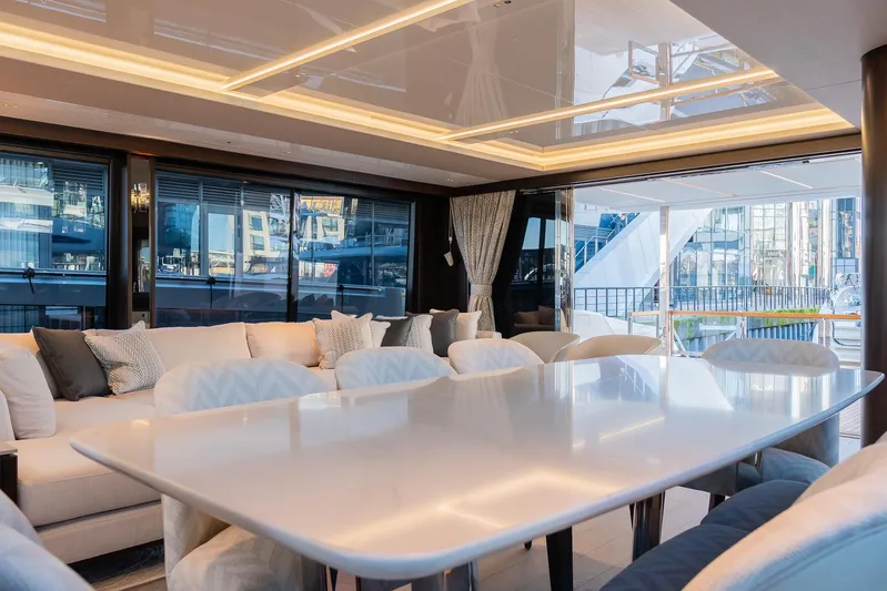  Yacht Photos Pics Luxurious interior of 2025 Sunseeker 90 Ocean yacht with elegant dining area.