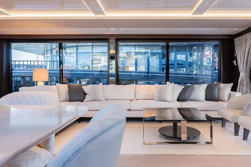  Yacht Photos Pics Luxurious interior of 2025 Sunseeker 90 Ocean yacht with modern furnishings and large windows.